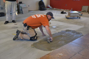 t600-David Freeman laying tile in women's dorm